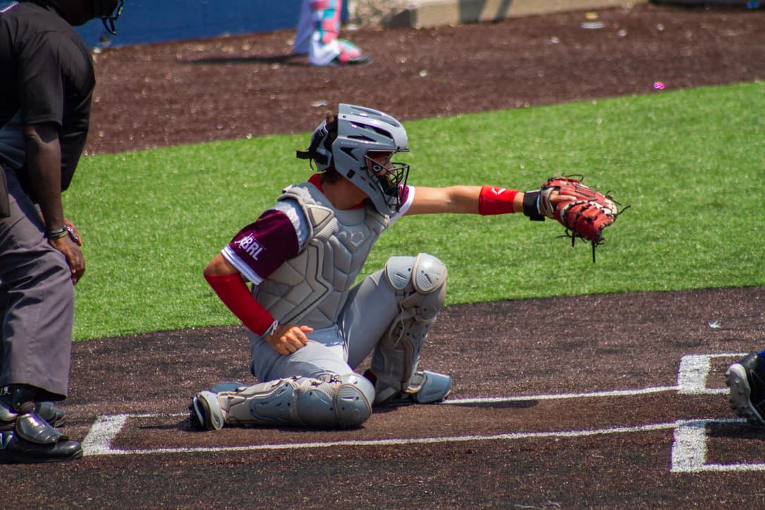 Colton Mitchell catching during a baseball game